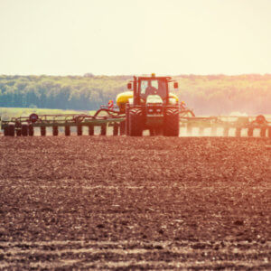 Large tractor working a farm field